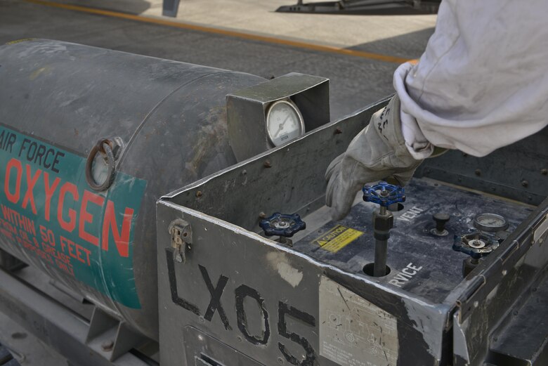 Senior Airman Matthew Krzywiecki, 379th Expeditionary Aircraft Maintenance Squadron, 746th Expeditionary Aircraft Maintenance Unit, monitors the pressure of liquid oxygen being recharged into a C-130 Hercules September 9, 2015 at Al Udeid Air Base, Qatar. The 746th AMU cryogenics airmen work with liquid nitrogen and liquid oxygen that is recharged into aircraft, providing aircrews with pure oxygen at altitude during missions in support of Operation Inherent Resolve.  Krzywiecki is a deployed member from the 911th Airlift Wing, Pittsburgh International Airport Air Reserve Station, Pa. (U.S. Air Force photo/Staff Sgt. Alexandre Montes)  