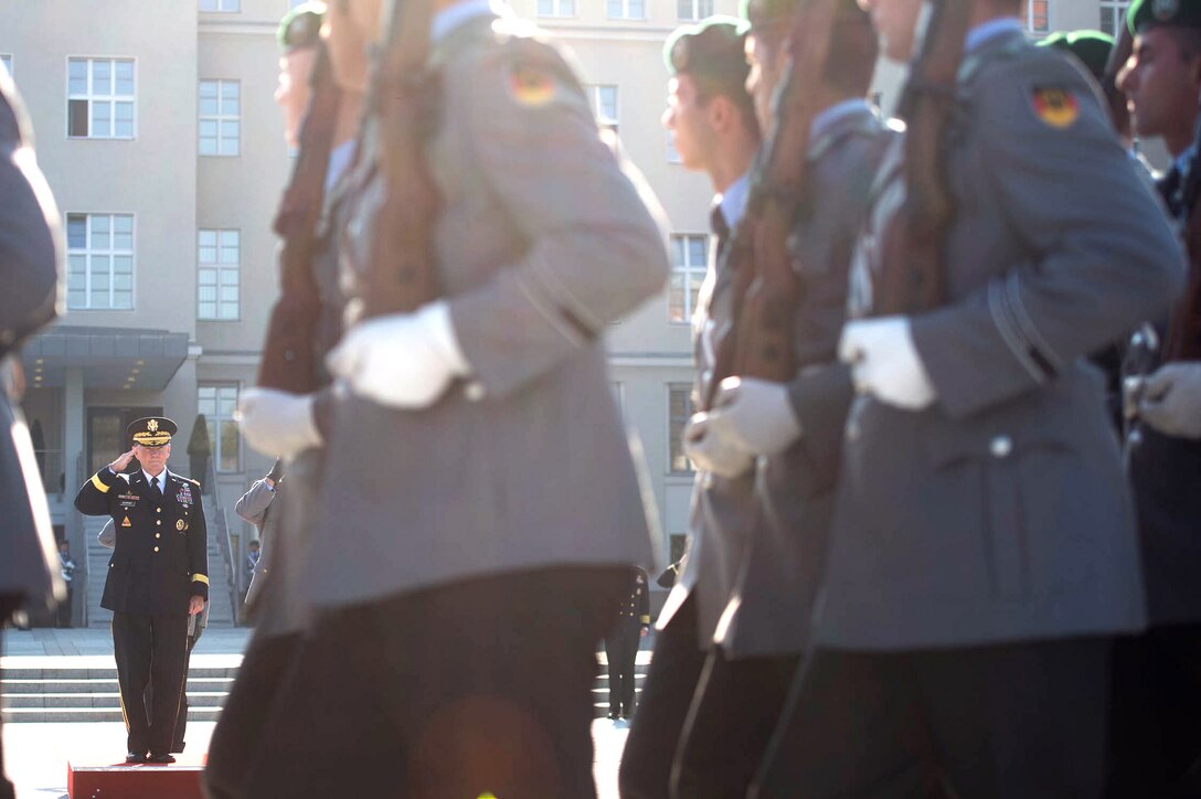 U.S. Army Gen. Martin E. Dempsey, chairman of the Joint Chiefs of Staff, salutes during a pass-and-review ceremony of the German honor guard at the Defense Ministry in Berlin, Sept. 10, 2015. DoD photo by D. Myles Cullen