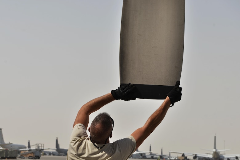 Staff Sgt. Eugene Wilson, 379th Expeditionary Aircraft Maintenance Squadron, 746th Expeditionary Aircraft Maintenance Unit, checks the movement of a C-130 Hercules propeller during a routine maintenance inspection September 9, 2015 at Al Udeid Air Base, Qatar. The 746th AMU airmen are responsible for ensuring aircraft are maintained to exact standards to support Operation Inherent Resolve. Wilson is deployed out of 911th Airlift Wing, Pittsburgh International Airport Air Reserve Station, Pa. (U.S. Air Force photo/Staff Sgt. Alexandre Montes)  