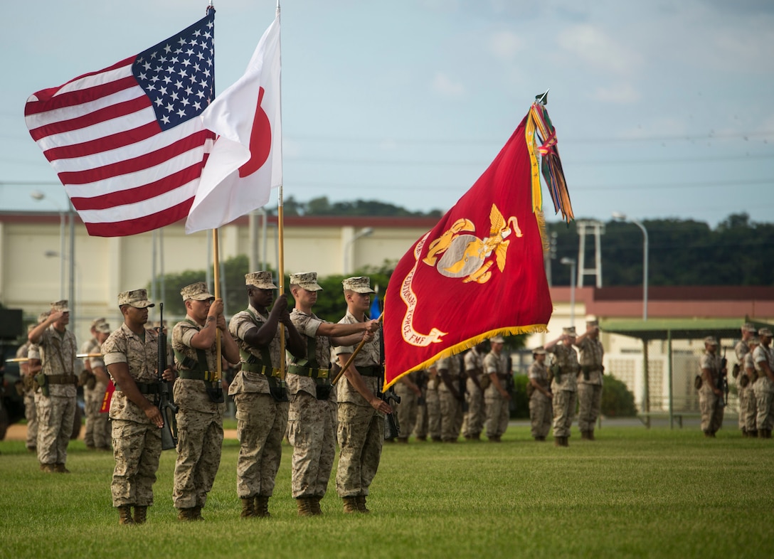 Marines present colors during the III Marine Expeditionary Force change of command ceremony at Camp Foster, Okinawa Sept. 11, 2015. During the ceremony, Lt. Gen. John Wissler relinquished command to Lt. Gen. Larry Nicholson. Wissler is a native of Camp Pendleton, Calif.; Nicholson is a native of Toronto.