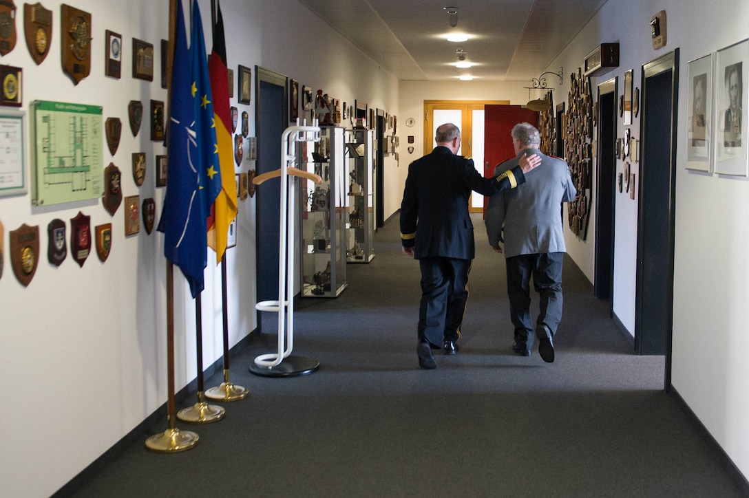 U.S. Army Gen. Martin E. Dempsey, left, chairman of the Joint Chiefs of Staff, and German Army Gen. Volker Wieker, chief of defense, walk at the Defense Ministry in Berlin, Sept. 10, 2015. DoD photo by D. Myles Cullen