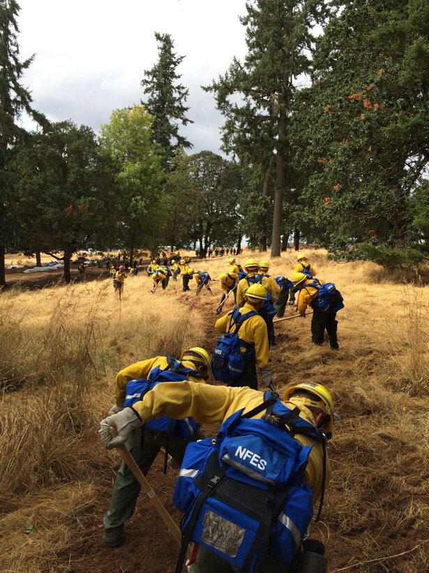 Members of the Oregon Air National Guard are training on equipment they will be using while assisting the wildland firefighters in cleanup operations Aug. 29, 2015 in Salem, Ore. To assist with firefighting efforts across the state, 125 Oregon ANG members were activated by the governor. Fifty-four of those Airmen were from the 173rd Fighter Wing at Kingsley Field, Ore. (U.S. Air National Guard photo)
