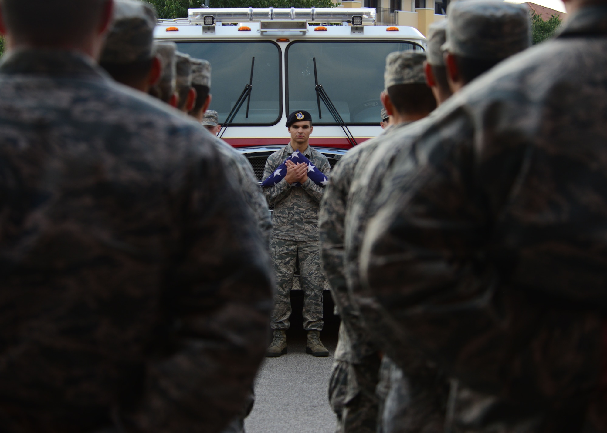 Senior Airman Brandon Almanzar-Harper, a 31st Secruity Forces Squadron defender, holds the U.S. flag during a 9/11 ceremony Sept. 11, 2015, at Aviano Air Base, Italy. The ceremony was held to commemorate the 11th anniversary of the Sept. 11, 2001 terrorist attacks that claimed the lives of approximately 3,000 innocent people at the World Trade Center, Shanksville, Penn., and the Pentagon. (U.S. Air Force photo/Staff Sgt. Evelyn Chavez)