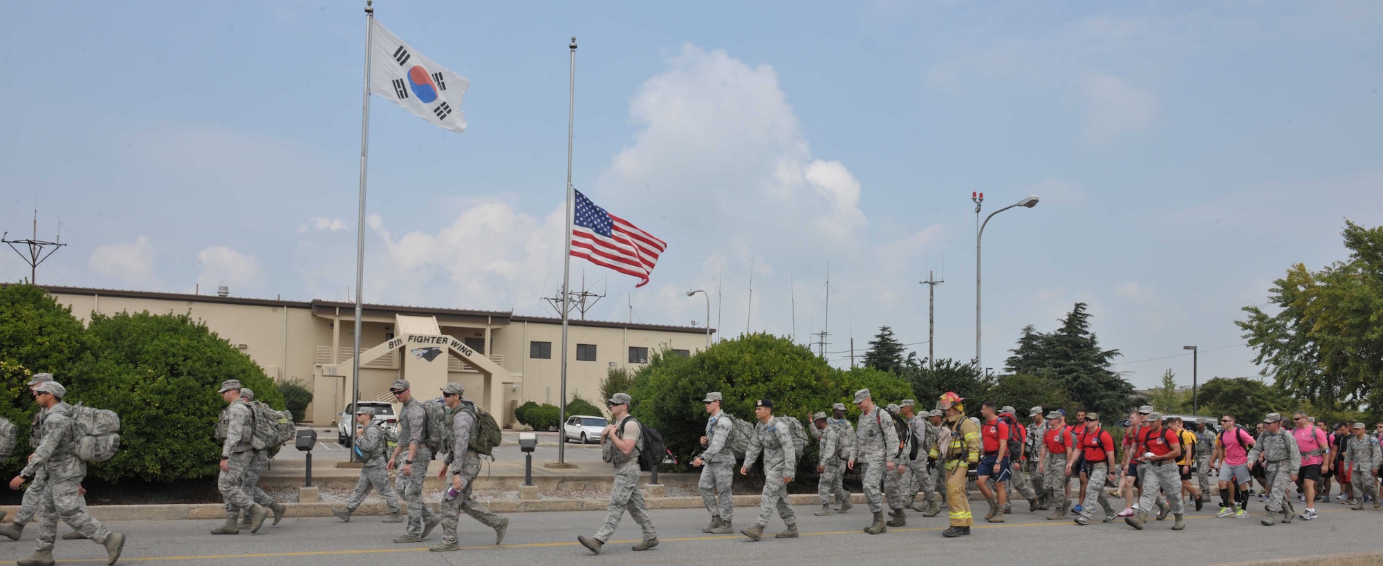 Members of the 8th Fighter Wing participate in a ruck march in remembrance of 9/11 at Kunsan Air Base, South Korea, Sept. 11, 2015. Airmen participated in the ruck march to honor those that gave their lives Sept. 11, 2001. (U.S. Air Force photo/Senior Airman Dustin King)