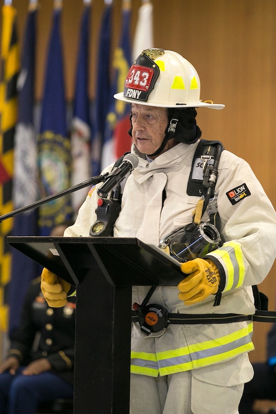 William Moore, U.S. Army Garrison Japan’s regional fire chief, provides a narrative of the events of Sept. 11, 2011, during a 9/11 memorial ceremony on Camp Zama, Japan, Sept. 11, 2015. U.S. Army photo by Randall Baucom