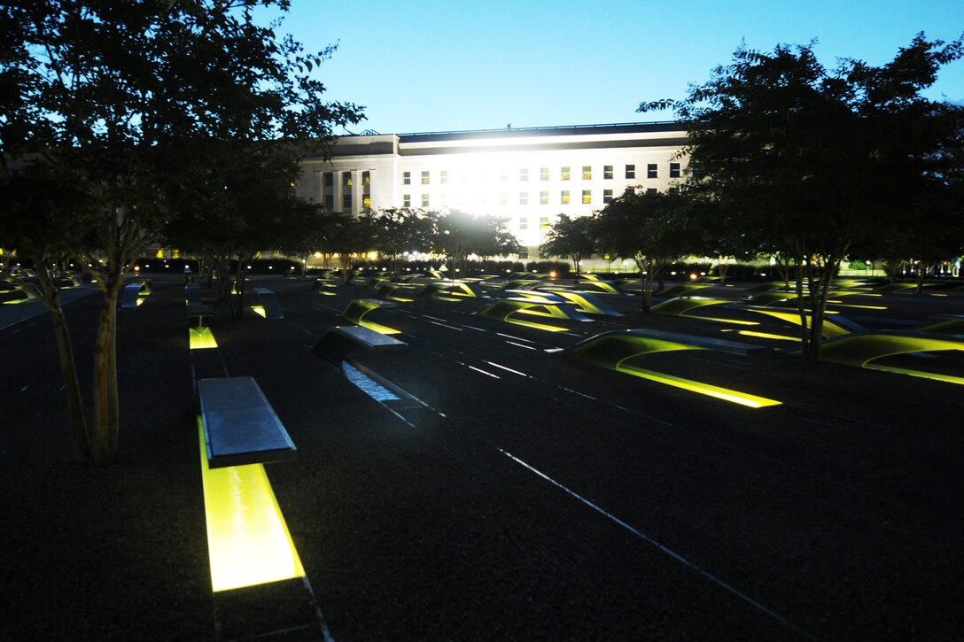 The early morning sun shines on the Pentagon Memorial, Sept. 11, 2015, before a remembrance ceremony to honor the 184 lives lost at the Pentagon during the 9/11 terrorist attack 14 years ago. U.S. Navy photo by Damon J. Moritz