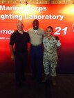 The Sergeant Major of the Marine Corps takes time to pose with SSgt Mayra Infante and Kyle Olson at the Marine Corps Warfighting Laboratory's booth during Marine Week Phoenix. 