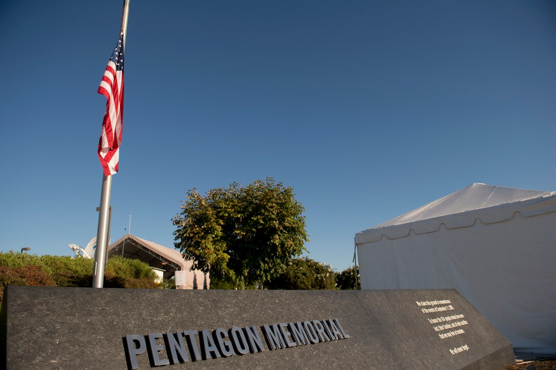 The flag flies at half staff as Defense Secretary Ash Carter and Air Force Gen. Paul J. Selva, vice chairman of the Joint Chiefs of Staff, host a remembrance ceremony at the Pentagon Memorial, Sept. 11, 2015, to honor the memory of those killed in the 9/11 terrorist attack. DoD photo by U.S. Air Force Senior Master Sgt. Adrian Cadiz