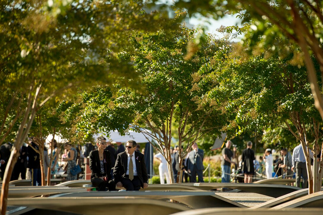 Friends and family members of those killed in the 9/11 terrorist attack at the Pentagon attend a remembrance ceremony at the Pentagon Memorial, Sept. 11, 2015. DoD photo by U.S. Air Force Senior Master Sgt. Adrian Cadiz