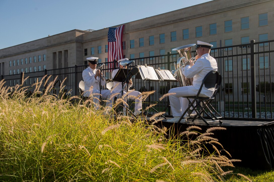 A Navy band plays music as Defense Secretary Ash Carter and Air Force Gen. Paul J. Selva, vice chairman of the Joint Chiefs of Staff, host a remembrance ceremony at the Pentagon Memorial, Sept. 11, 2015, to honor the memory of those killed in the 9/11 terrorist attack. DoD photo by U.S. Air Force Senior Master Sgt. Adrian Cadiz