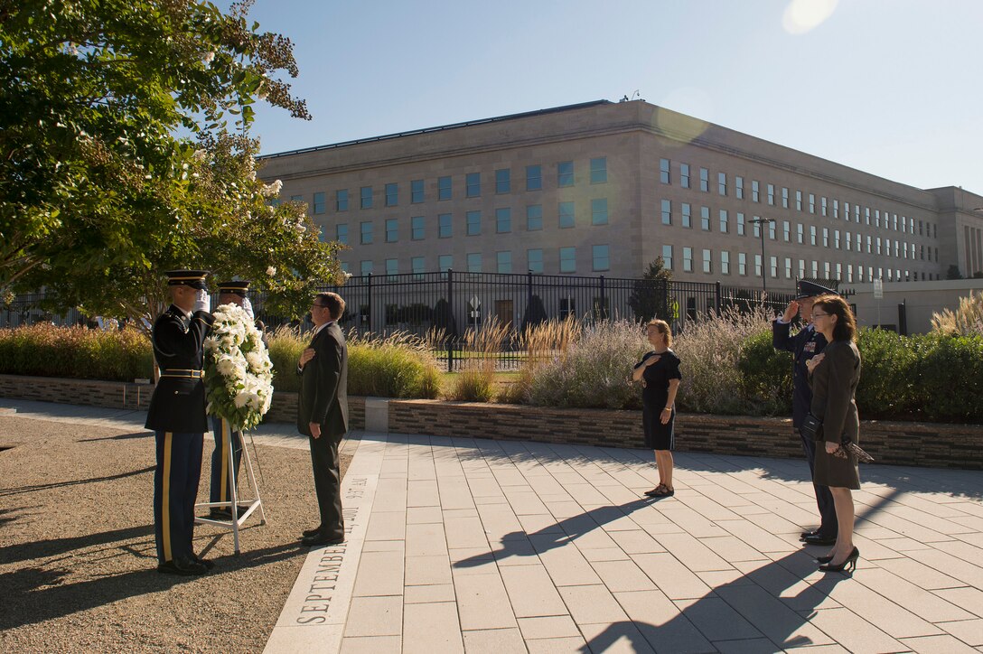 Defense Secretary Ash Carter presents a wreath during the remembrance ceremony at the Pentagon Memorial, Sept. 11, 2015, to honor the memory of those killed in the 9/11 terrorist attack. DoD photo by U.S. Air Force Senior Master Sgt. Adrian Cadiz