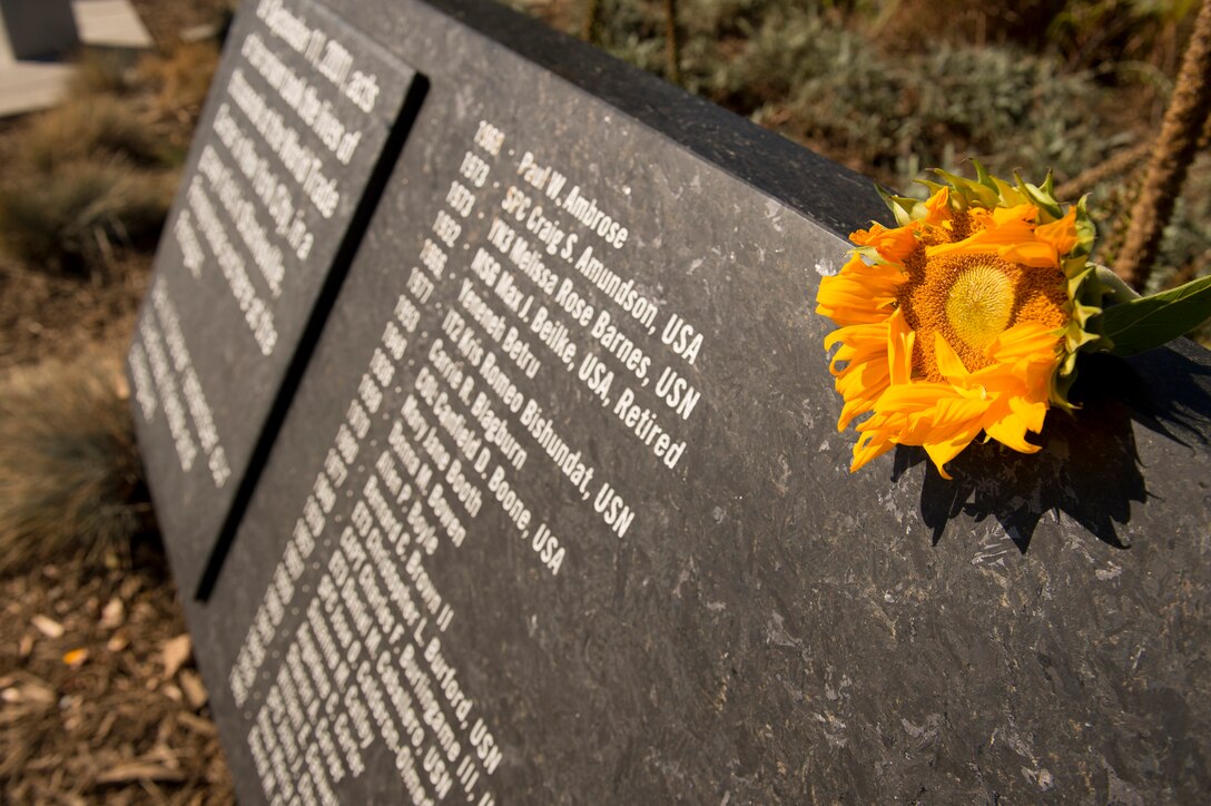 A flower sits on a part of the Pentagon Memorial, Sept. 11, 2015, during a remembrance ceremony to honor the memory of those killed in the 9/11 terrorist attack. DoD photo by U.S. Air Force Senior Master Sgt. Adrian Cadiz