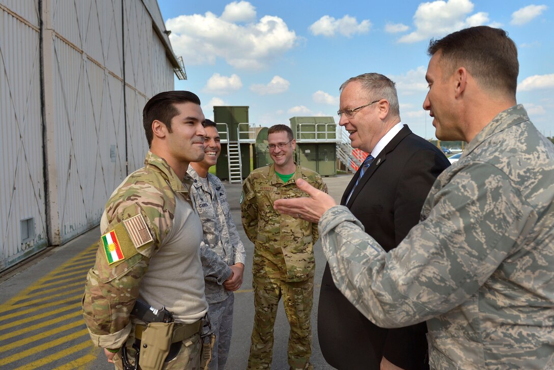 U.S. Air Force Col. Robert Novotny, right, introduces U.S. Deputy Defense Secretary Bob Work to U.S. airmen on Royal Air Force Lakenheath, England, Sept. 11, 2015. The airmen are assigned to the 57th Rescue Squadron. DoD photo by Glenn Fawcett