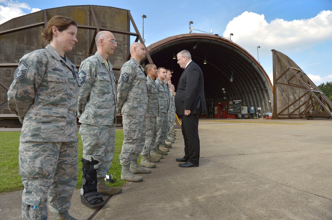 U.S. Deputy Defense Secretary Bob Work talks with U.S. airmen while visiting U.S. Air Force operations at Royal Air Force Lakenheath, England, Sept. 11, 2015. The airmen are assigned to the 493rd Fighter Squadron. DoD photo by Glenn Fawcett