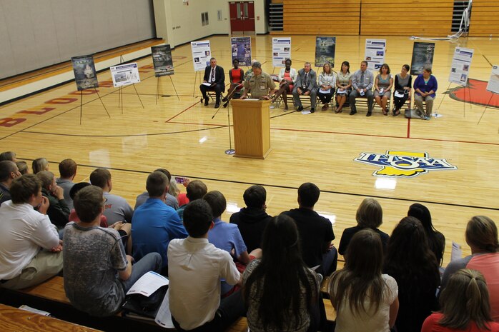 BLOOMFIELD, Indiana - Naval Surface Warfare Center, Crane Division (NSWC Crane) has partnered with the DirectEmployers Foundation, Bloomfield Jr./Sr. High School and Indiana University’s Center for P-16 Research and Collaboration to put personnel into the classroom as part of a total immersion project designed to bring the naval installation into the school system.  Representatives from each of the partner organizations met with students at the school on Tuesday, Sept. 8 to explain the new business simulation pilot program, which will immerse kids in a corporate environment while augmenting their Science, Technology, Engineering and Mathematics (STEM) education.  