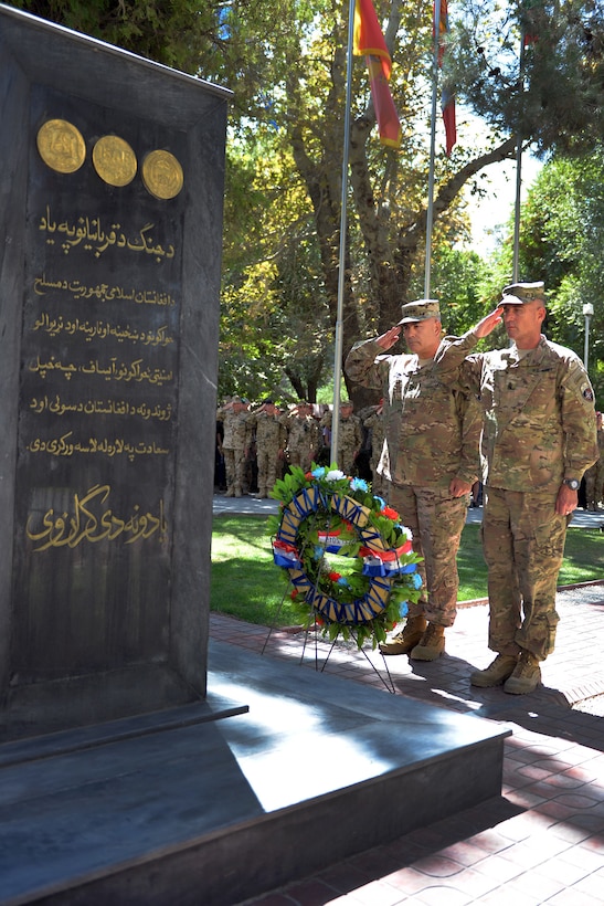 U.S. Army Gen. John. F. Campbell, left, commander of the Resolute Support Mission and U.S. Forces in Afghanistan, and U.S. Army Command Sgt. Maj. Delbert Byers render honors observing the anniversary of the 9/11 attacks during a wreath-laying ceremony in Kabul, Afghanistan, Sept. 11, 2015. U.S. Air Force photo by Tech. Sgt. Robert Sizelove