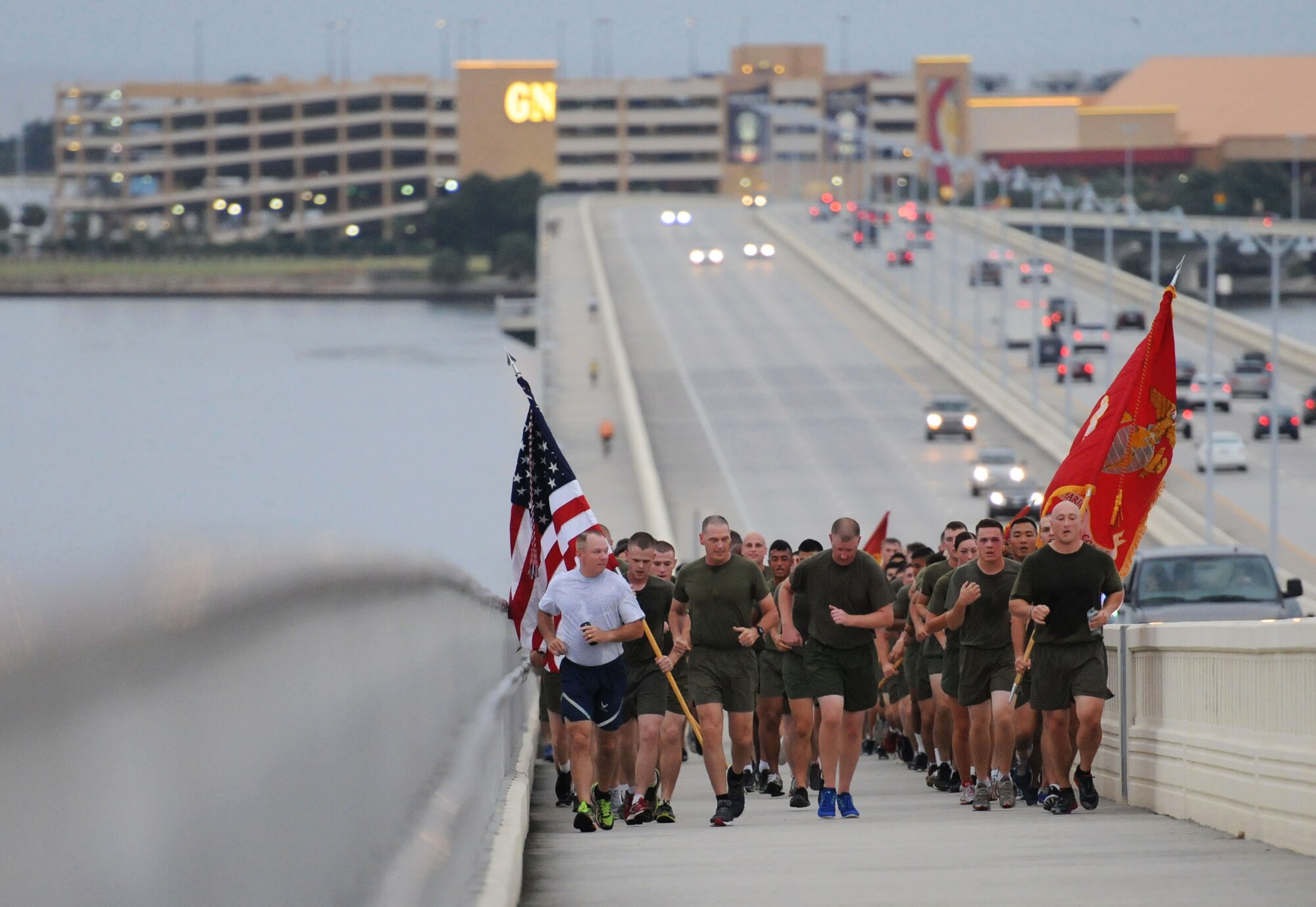 Col. Scott Solomon, 81st Training Group commander, and Keesler Marine Corps Detachment commanding officer Maj. Cody Stewart, lead members of the Keesler Marine Det. in a 3.7 mile remembrance run across the Ocean Springs/Biloxi Bridge during a physical training session Sept. 11, 2015. The event honored those who lost their lives during the 9/11 attacks. (U.S. Air Force photo by Kemberly Groue)