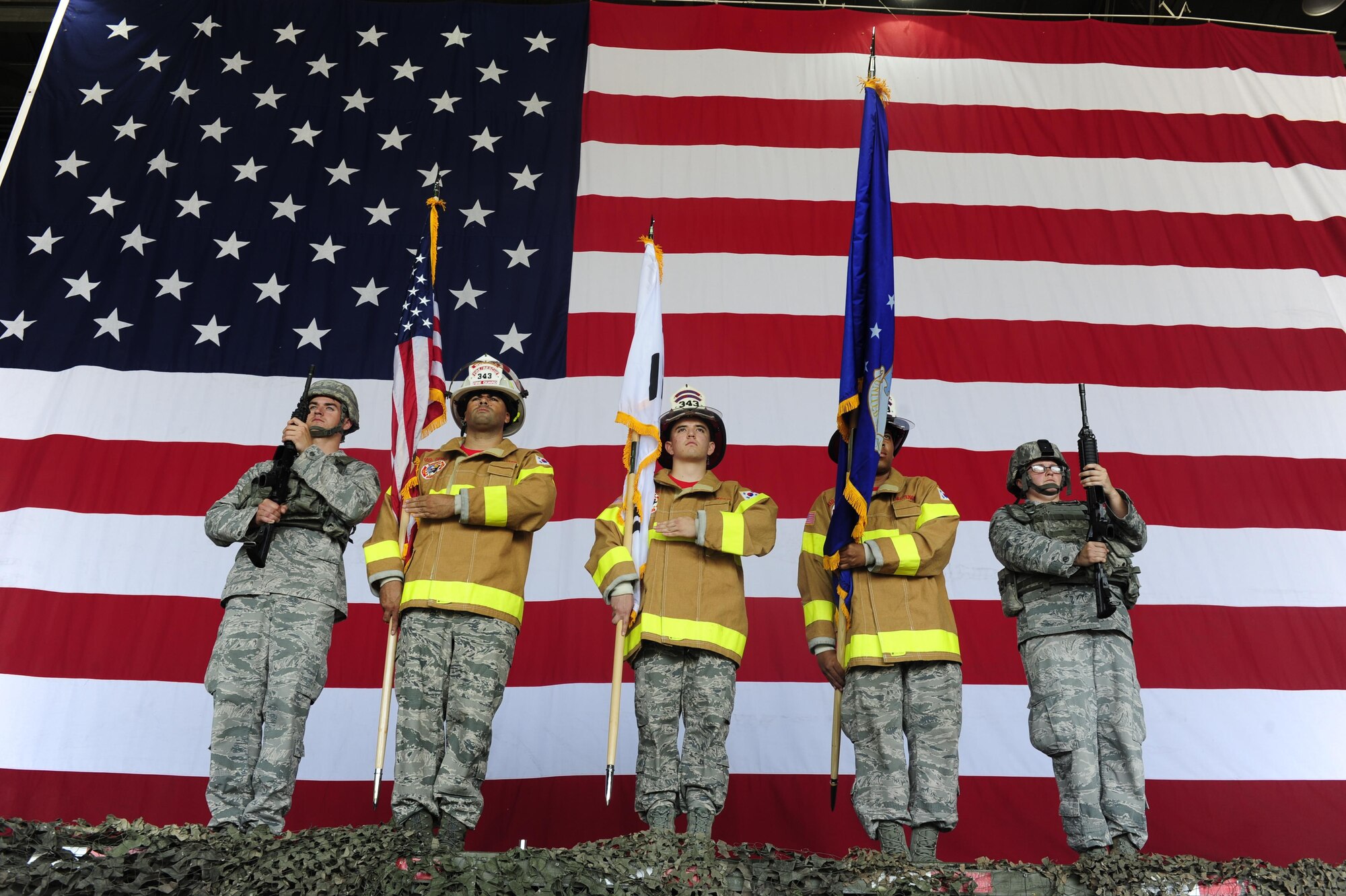 Airmen from the 8th Fighter Wing prepare to post the colors during a 9/11 Remembrance Day Ceremony at Kunsan Air Base, South Korea, Sept. 11, 2015. Airmen and members from South Korea’s air force attended the ceremony to remember the events that occurred during the terrorist attacks 14 years ago. (U.S. Air Force photo/Staff Sgt. Nick Wilson)