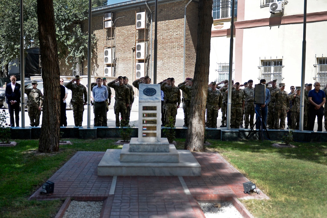 Coalition, U.S. service members and civilians render honors on the anniversary of the 9/11 attacks during a wreath-laying ceremony in Kabul, Afghanistan, Sept. 11, 2015. U.S. Navy photo by Lt. Kristine Volk