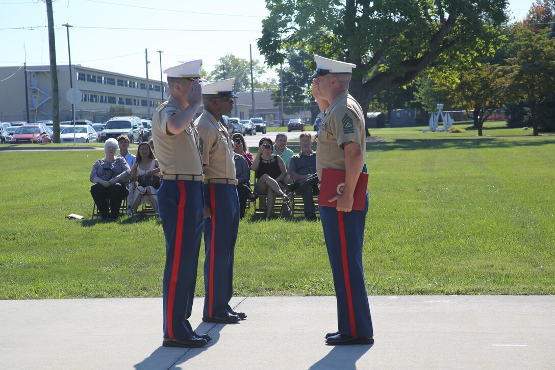 U.S. Marine Corps Master Sgt. Jay Wilfrom, right, the adjutant chief for the 4th Marine Corps District and Pittsburgh, Pennsylvania native, salutes U.S. Marine Corps Col. John Bolt, 4th MCD commanding officer, after receiving his second Navy Marine Corps Medal at the Defense Distribution Center Susquehanna in New Cumberland, Pennsylvania, Sept. 11, 2015. He received his first in 1995 for saving a teenage military dependent from drowning in Iwakuni, Japan. He received his second for saving a woman from her burning house in 2014. (U.S. Marine Corps photo by Cpl. Tyler Birky/Released)