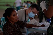 U.S. Air Force Maj. Richard Trowbridge, a general practice physician, works to remove a patient's epidermal cyst during a Pacific Angel 15-2 healh services outreach Sept. 7, 2015, in Baucau, Timor-Leste. Pacific Angel is a multilateral humanitarian assistance civil military operation, which improves military-to-military partnerships in the Pacific while also providing medical health outreach, civic engineering projects and subject matter exchanges among partner forces. (U.S. Air Force photo by Staff Sgt. Alexander W. Riedel/Released)