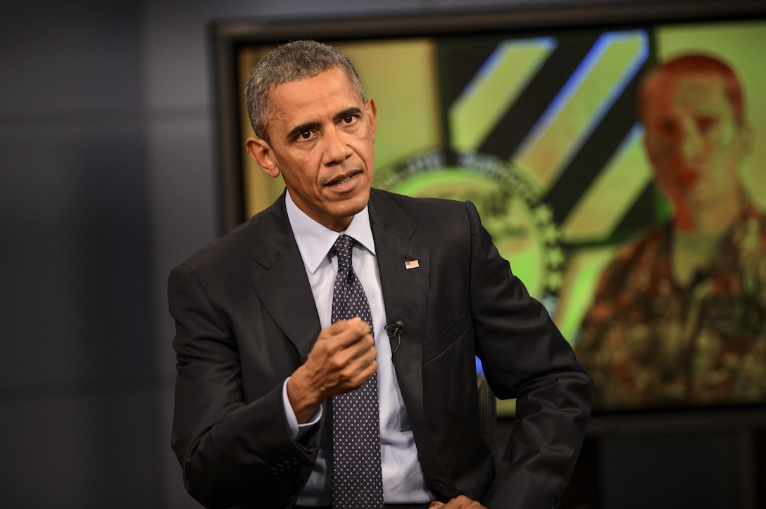 President Barack Obama answers a question from an overseas service member during his worldwide troop talk from Fort Meade, Md., Sept. 11, 2015. Obama visited the base to conduct a live, televised troop talk with service members on the 14th anniversary of 9/11 from the Defense Media Activity studios. DoD photo by Marvin Lynchard