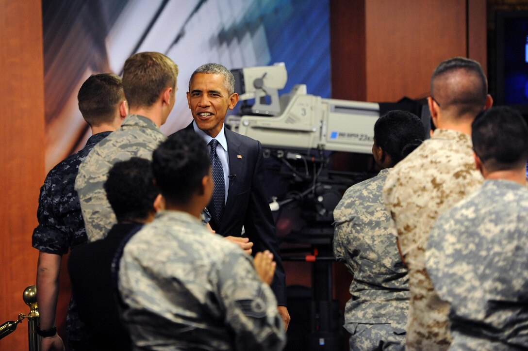 Service members interact with President Barack Obama during his worldwide troop talk from the studios on Fort Meade, Md., Sept. 11, 2015. DoD photo by Marvin Lynchard