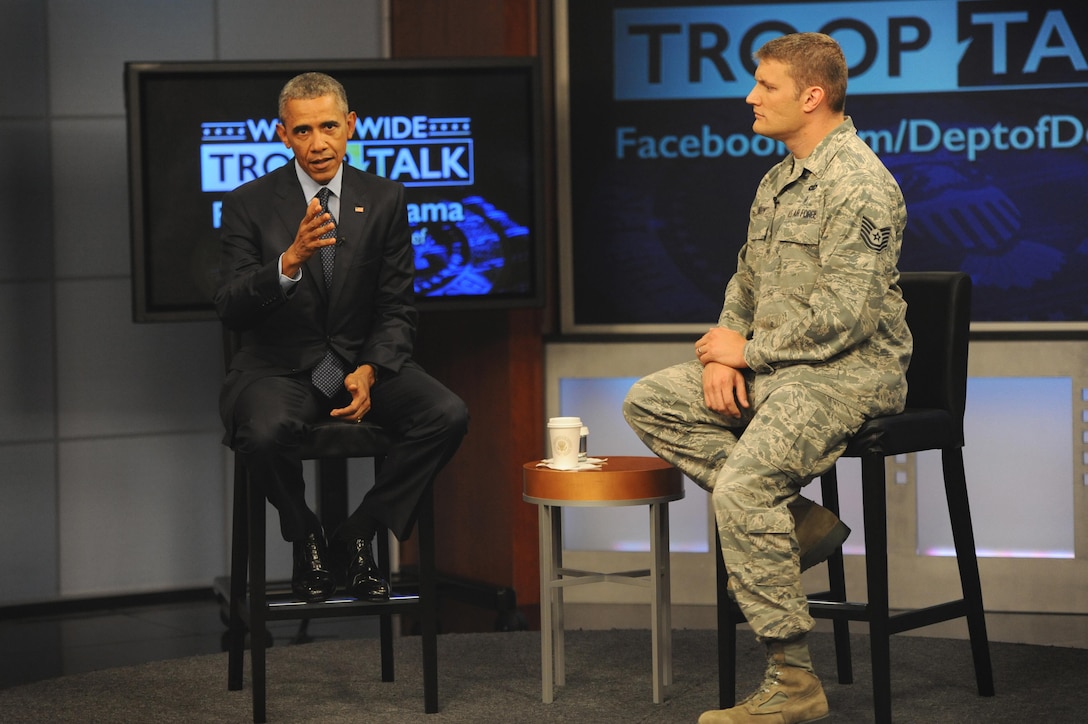 President Barack Obama sits with Air Force Tech Sgt. Nathan Parry, the moderator of the president's worldwide troop talk, on a set from Fort Meade, Md., Sept. 11, 2015. DoD photo by Marvin Lynchard
