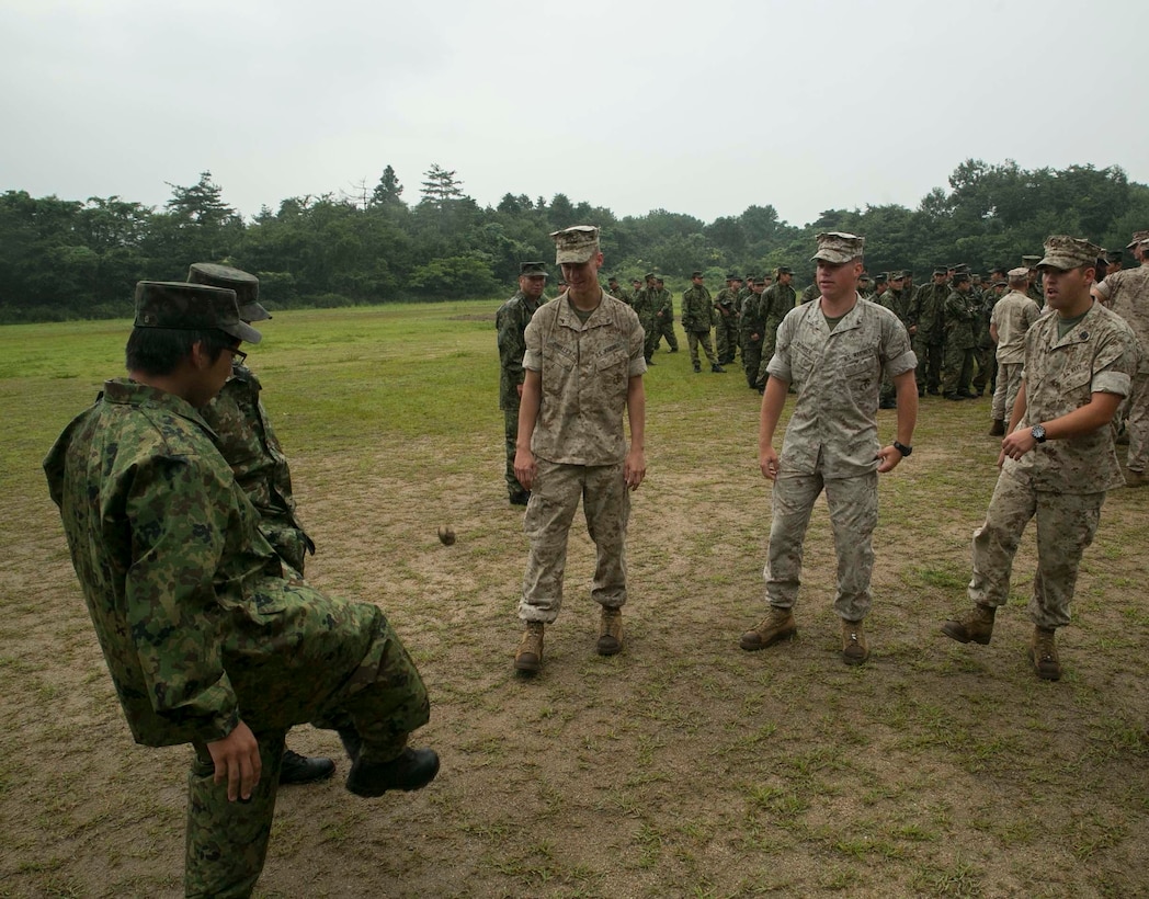 U.S. Marines and Japanese Ground Self-Defense members play Hacky Sack after the opening ceremony of Forest Light 16-1 at Camp Imazu, Takashima, Japan, Sept. 6, 2015. Forest Light will take place Sept. 7-18 with approximately 240 Marines working next to 350 JGSDF members. The exercise will consist of combined mortar live fire, establishing forward arming and refueling points training, combined helicopter borne skills and combined-arms training. The JGSDF members are from 50th Infantry Regiment, 14th Brigade. The Marines are with 1st Battalion, 2nd Marine Regiment currently assigned to 4th Marine Regiment, 3rd Marine Division, III Marine Expeditionary Force.
