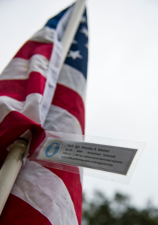Tech. Sgt. Timothy Weiner’s name was attached to one of the flags set up on the Field of Valor display in Niceville, Fla. Sept. 11.  The display features 13 rows of 27 flags and one extra to create the field.  Names of recently fallen military members, including 10 Airmen, adorn each of the approximately 352 American flags.  The Field will be on display through Sept. 19 at the Mullet Festival grounds and is free to the public.  (U.S. Air Force photo/Tech. Sgt. Sam King)