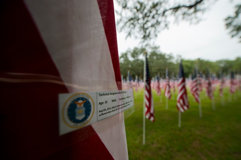 Tech. Sgt. John Brown’s name was attached to one of the flags set up on the Field of Valor display in Niceville, Fla. Sept. 11.  The display features 13 rows of 27 flags and one extra to create the field.  Names of recently fallen military members, including 10 Airmen, adorn each of the approximately 352 American flags.  The Field will be on display through Sept. 19 at the Mullet Festival grounds and is free to the public.  (U.S. Air Force photo/Tech. Sgt. Sam King)