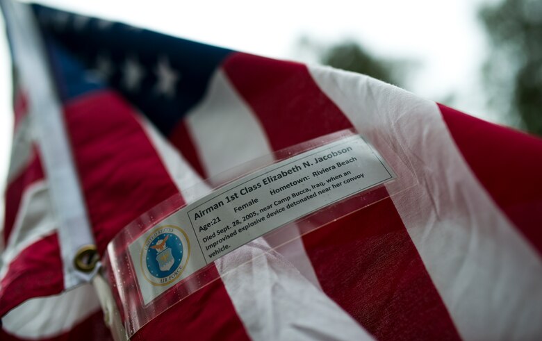 Airman 1st Class Elizabeth Jacobson’s name was attached to one of the flags set up on the Field of Valor display in Niceville, Fla. Sept. 11.  The display features 13 rows of 27 flags and one extra to create the field.  Names of recently fallen military members, including 10 Airmen, adorn each of the approximately 352 American flags.  The Field will be on display through Sept. 19 at the Mullet Festival grounds and is free to the public.  (U.S. Air Force photo/Tech. Sgt. Sam King)