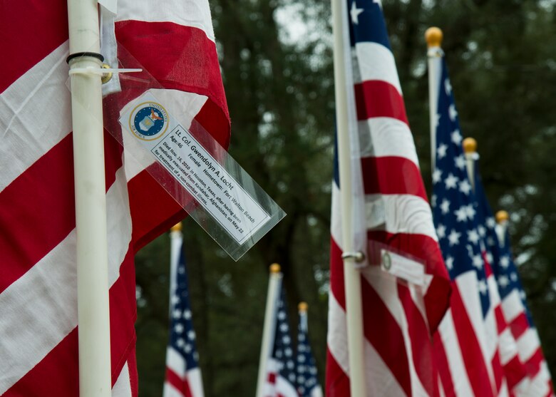 Lt. Col. Gwendolyn Locht’s, a Fort Walton Beach native, name was attached to one of the flags set up on the Field of Valor display in Niceville, Fla. Sept. 11.  The display features 13 rows of 27 flags and one extra to create the field.  Names of recently fallen military members, including 10 Airmen, adorn each of the approximately 352 American flags.  The Field will be on display through Sept. 19 at the Mullet Festival grounds and is free to the public.  (U.S. Air Force photo/Tech. Sgt. Sam King)