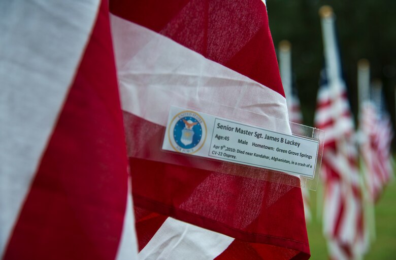 Senior Master Sgt. James Lackey’s name was attached to one of the flags set up on the Field of Valor display in Niceville, Fla. Sept. 11.  The display features 13 rows of 27 flags and one extra to create the field.  Names of recently fallen military members, including 10 Airmen, adorn each of the approximately 352 American flags.  The Field will be on display through Sept. 19 at the Mullet Festival grounds and is free to the public.  (U.S. Air Force photo/Tech. Sgt. Sam King)