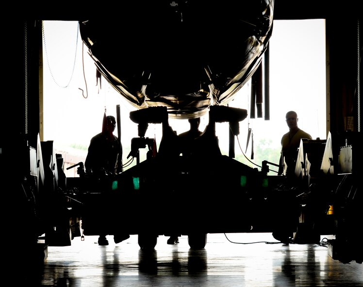 2nd Munitions Squadron cruise missile maintainers prepare a loader to receive conventional air-launched cruise missiles at Barksdale Air Force Base, La., Aug. 29, 2015. Transferring the cruise missile onto the loader requires several maintainers working together in order to get the job done safely and smoothly. (U.S. Air Force Photo/Airman 1st Class Luke Hill)