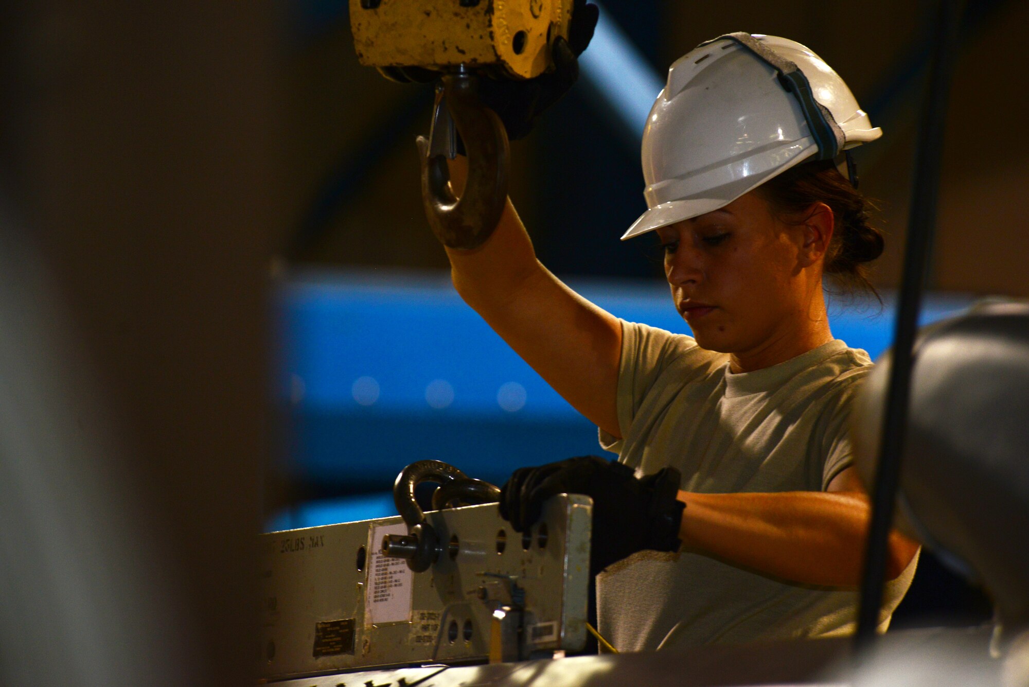 Senior Airman Jeanne Rhoads, 2nd Munitions Squadron cruise missile team chief, detaches a cruise missile from a lift at Barksdale Air Force Base, La., Aug. 29, 2015. The conventional air-launched cruise missile travels at 550 miles per hour and delivers a 3,000 pound fragmentation warhead. (U.S. Air Force Photo/Airman 1st Class Luke Hill)
