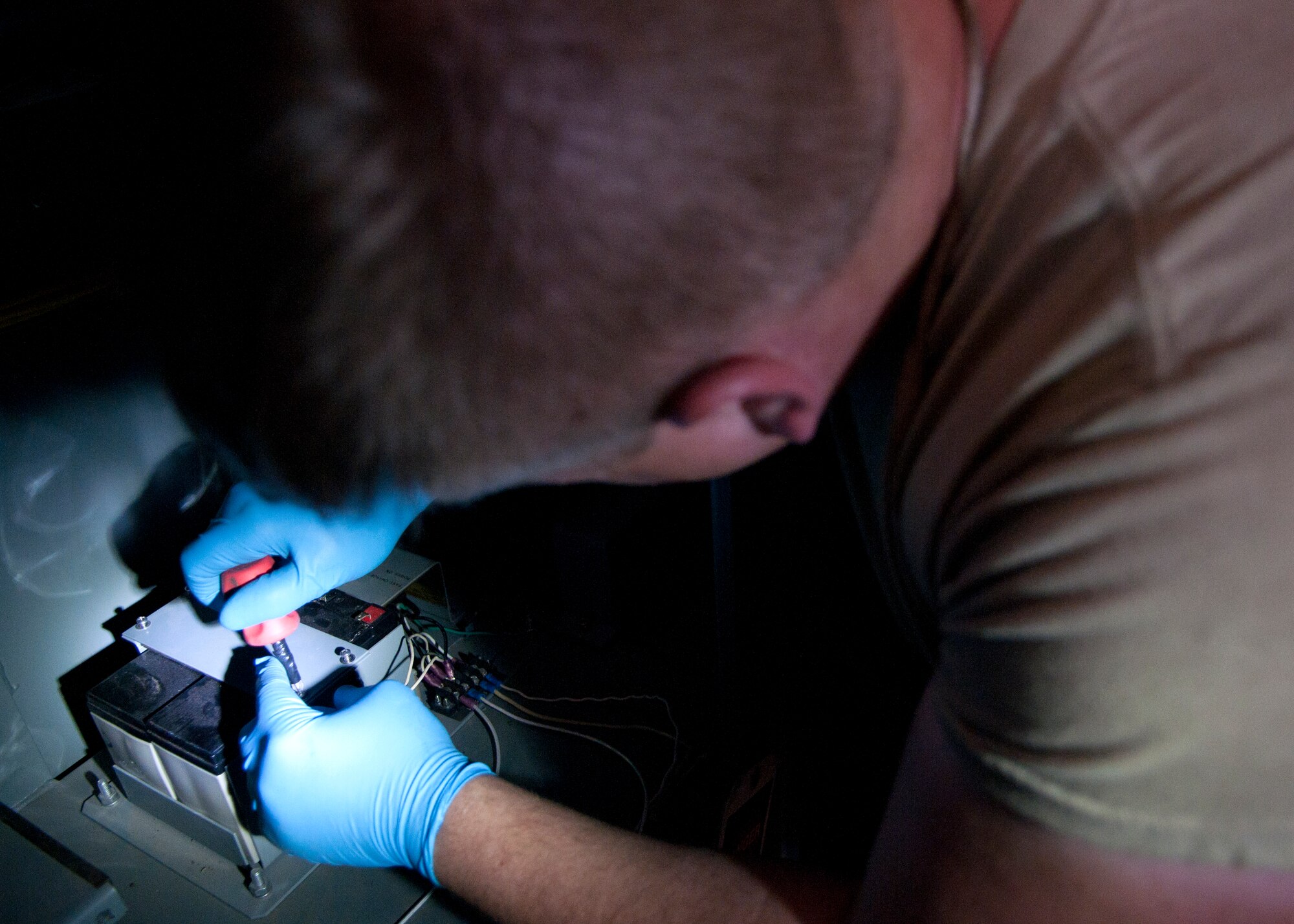 Airman 1st Class Blaine Krause, 90th Missile Maintenance Squadron Periodic Maintenance Team technician, replaces a launch support building’s power processor batter, in the F.E. Warren Air Force base, Wyo., missile complex, Sept. 2, 2015. The power processor allows the site to transition from commercial power to the back-up generator during commercial power blackouts. (U.S. Air Force photo by Airman 1st Class Malcolm Mayfield)