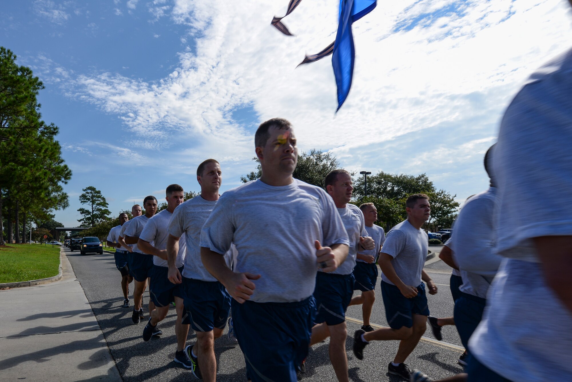 Airmen from the 23d Civil Engineer Squadron jog the last stretch of the Tiger-thon, Sept.11, 2015, at Moody Air Force Base, Ga. This is the 7th annual Tiger-thon honoring approximately 83,000 prisoners of war and missing in action, past and present. (U.S. Air Force photo by Airman First Class Janiqua P. Robinson/Released)