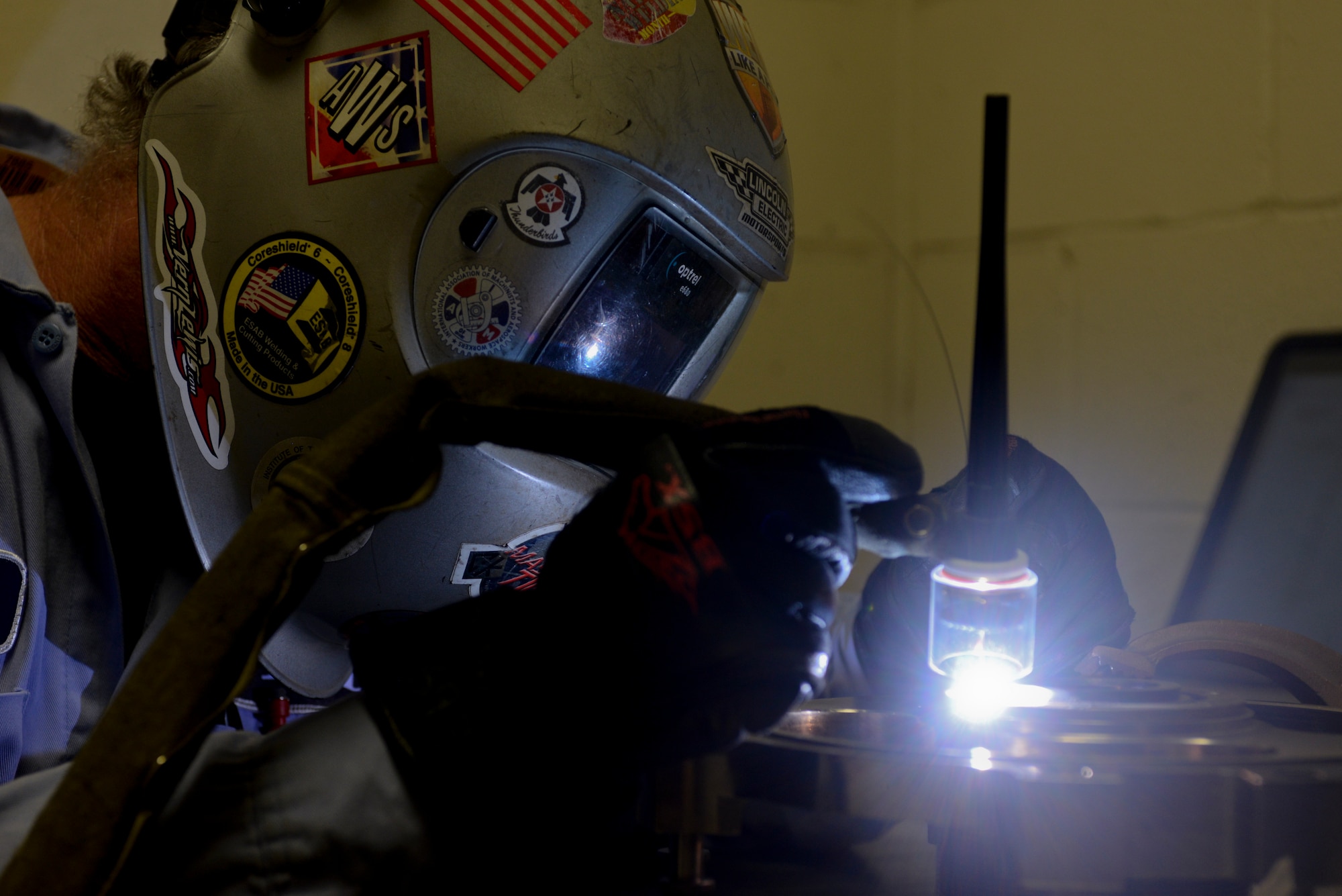 Rich Samanich, 57th Maintanence Group aircraft metals technology lead, welds cracks on an aircraft part at the Aircraft Metals Technology shop on Nellis Air Force Base, Nev., Sept. 3, 2015. The aircraft metals technicians weld a multitude of equipment requiring precision and attention to detail. (U.S. Air Force photo by Airman 1st Class Mikaley Kline)