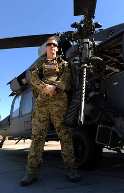 Staff Sgt. Sven Raemer, 34th Weapons Squadron special mission aviator, stands next to a .50 caliber machine gun mounted on an HH-60G Pave Hawk at Nellis Air Force Base, Nev., Sept. 8, 2015. Raemer was recently awarded the Staff Sgt. Henry “Red” Erwin Outstanding Enlisted Aircrew Member Airman of the Year Award for his actions in support of Operation Enduring Freedom, showcasing his leadership abilities and further his education by working towards a Bachelor’s degree. The annual award is presented to an enlisted aircrew Airman for his or her outstanding accomplishments related to flight activities, how their leadership abilities impact unit members and what actions the Airman has taken for self-improvement through education and training. (U.S. Air Force photo by Senior Airman Thomas Spangler)