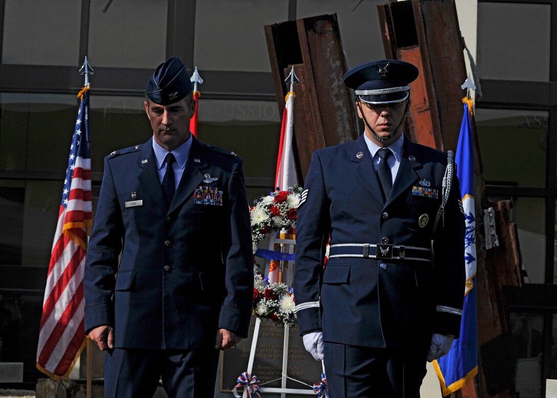 Col. John Ferry, 601st Air Operations Center Commander and Staff Sgt. Christopher Jones, 601st AOC Color Guard, depart after placing a wreath at the 601st  AOC 9/11 Memorial during a remembrance ceremony Sept. 11.  (Air Force Photo Released/Airman 1st Class Sergio Gamboa)