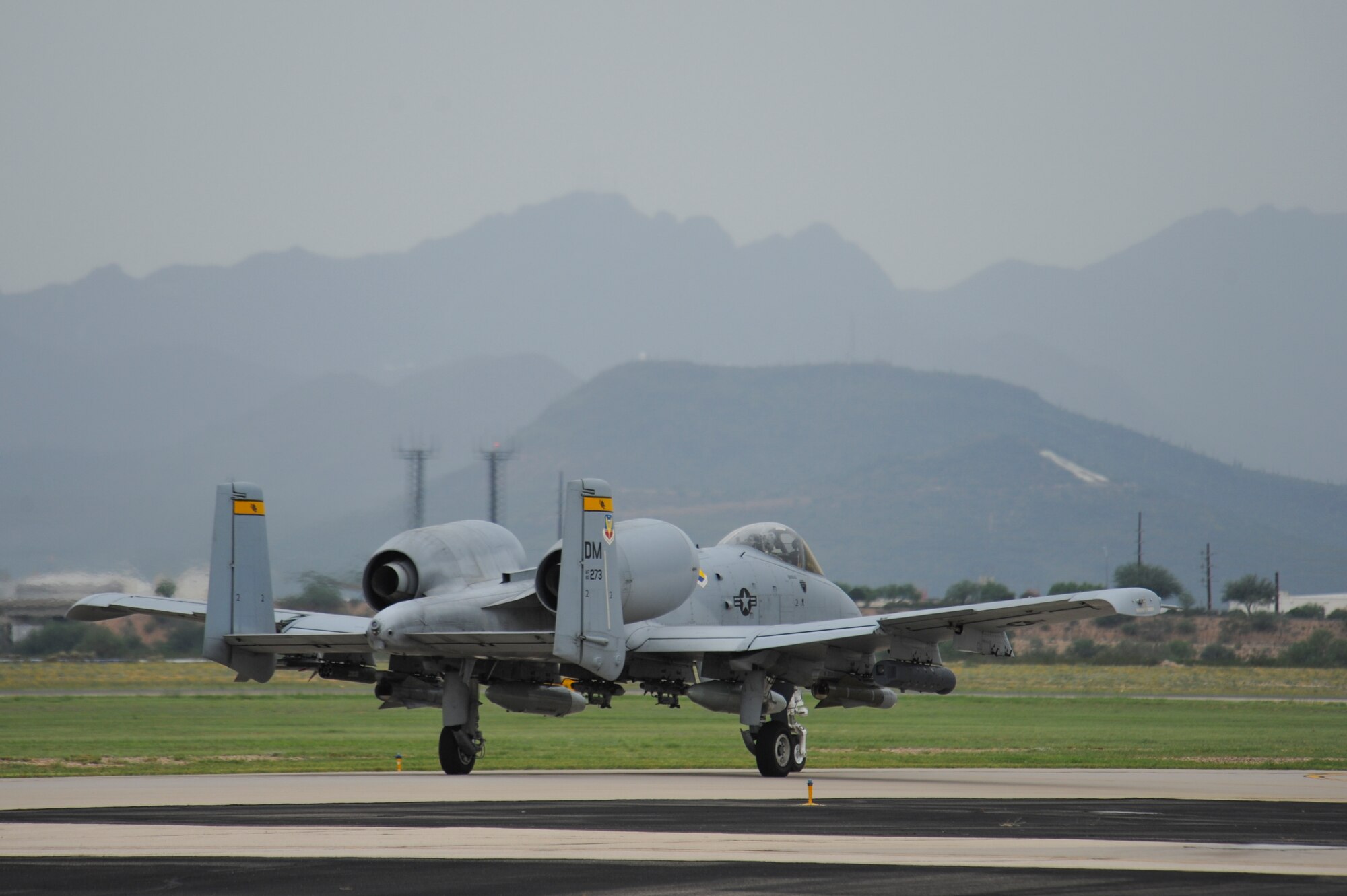An A-10C Thunderbolt II from the 357th Fighter Squadron taxis down the flight line at Davis-Monthan Air Force Base, Ariz., Sept. 10, 2015, before departing for Nellis Air Force Base, Nev., to participate in Green Flag 15-10.  Green Flag is an advanced, realistic and relevant air to surface training exercise that prepares joint and coalition warfighters to meet combatant commander requirements across air, space and cyberspace.  (U.S. Air Force photo by Senior Airman Chris Massey/Released)
