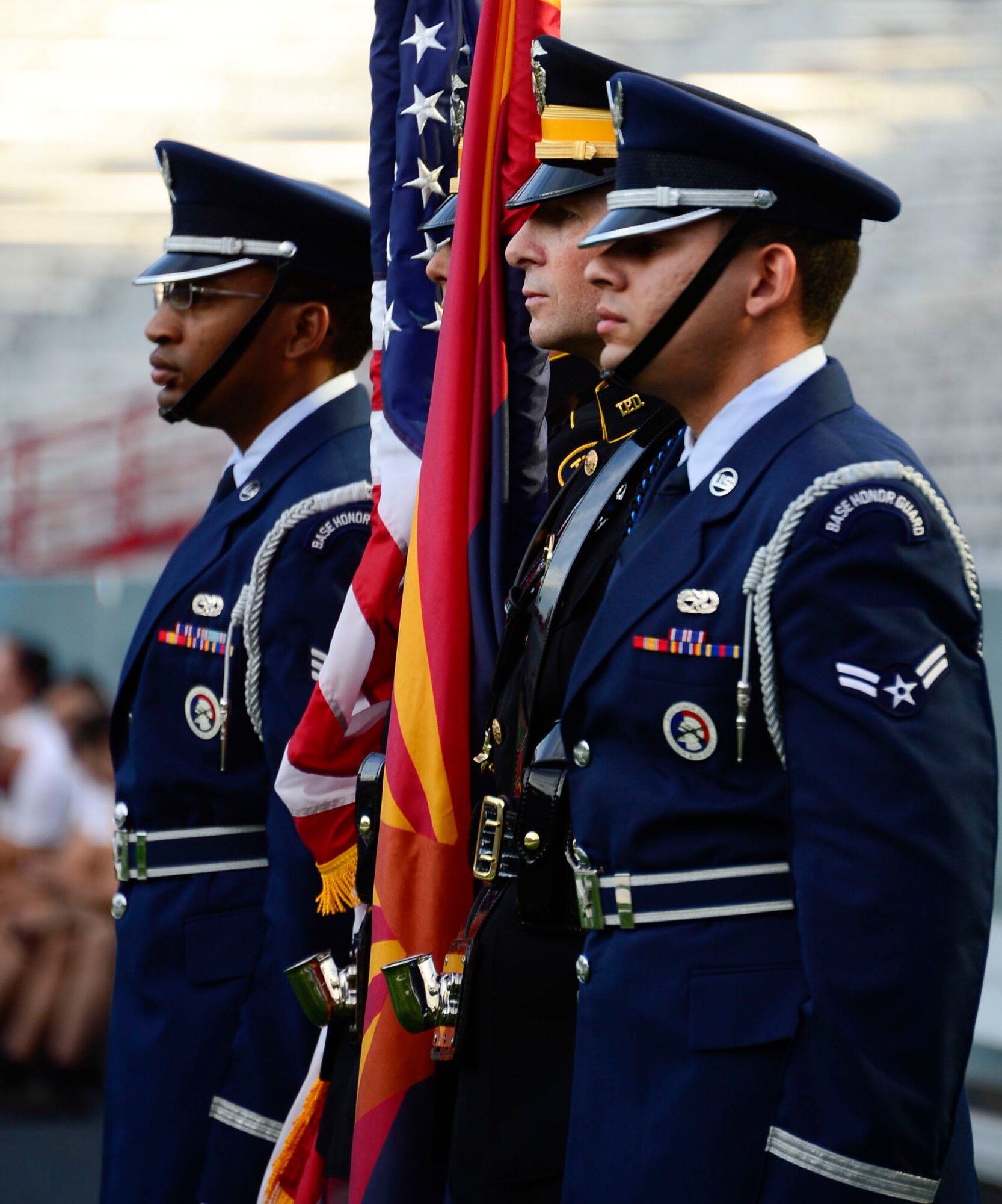 Members of the Davis-Monthan and Tucson Police Department Honor Guard post the colors during the 9/11 Tower Challenge at the University of Arizona football stadium in Tucson, Ariz., Sept. 11, 2015. Members of 12th Air Force (Air Forces Southern) joined the Tucson community to honor those who lost their lives during the Sept. 11, 2001 attacks and to show their support for first responders and military members who continue to protect the U.S. from foreign and domestic threats. During the 9/11 Tower Challenge, participants climbed 2,071 steps representing the number of steps that were in the Twin Towers. (U.S. Air Force Photo by Tech. Sgt. Heather R. Redman/Released)