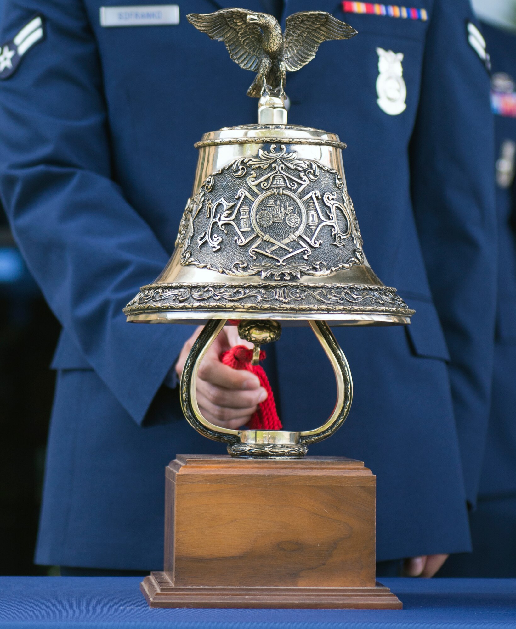 U.S. Air Force Airman 1st Class Brandon Sofranko, 23d Civil Engineer Squadron firefighter, rings a traditional firefighter bell, known as the “Last Call,” honoring those who perished in the 9/11 terrorist attacks during a remembrance ceremony at Moody Air Force Base, Ga. The Last Call is held during funeral services and once also signaled the start and end of an alarm for firefighters. (U.S. Air Force photo by Airman Greg Nash/Released) 