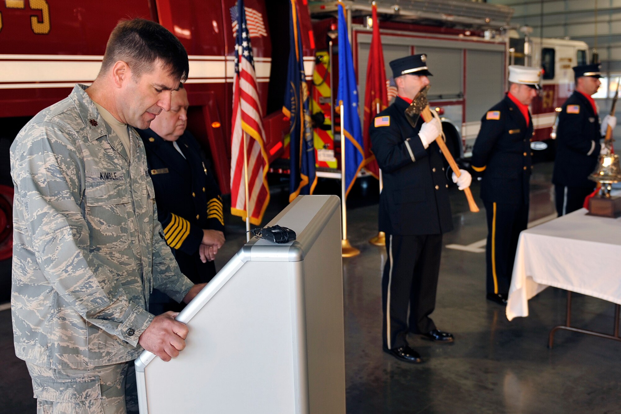 U.S. Air Force Chaplain (Maj.) Bradley Kimble, 55th Wing chaplain, provides an invocation during a 9/11 memorial tribute held Sept. 11 at the Offutt Air Force Base main fire station. The ceremony honored the memory of those lost in the Sept. 11, 2001 terrorist attacks. (U.S. Air Force photo by Jeff W. Gates/Released)