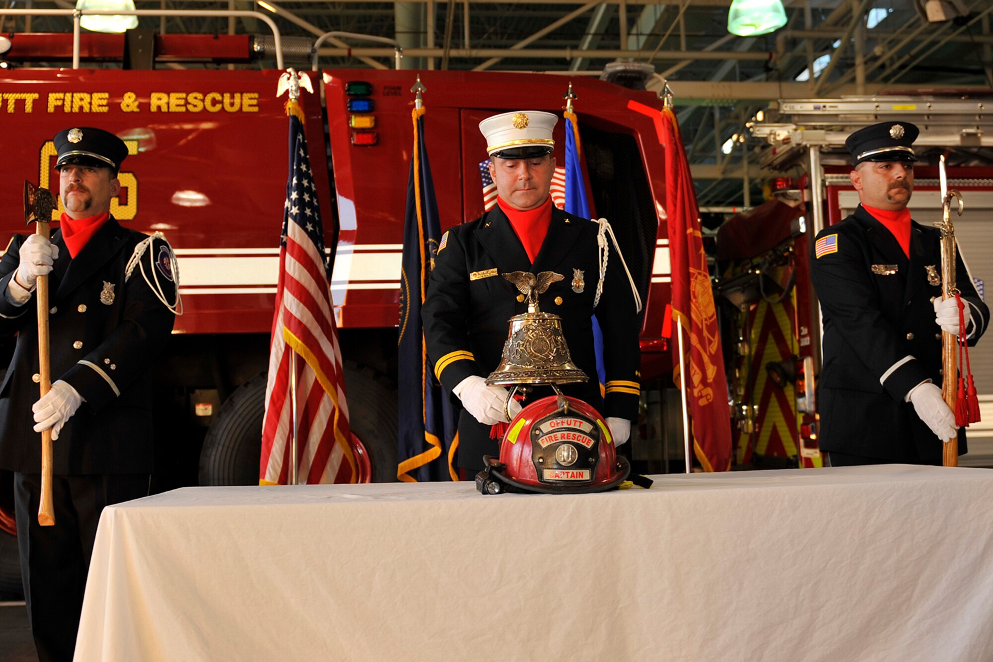 Arpad Lepper, Offutt Air Force Base Fire Department station chief and ceremonial guardsman, rings a bell to honor those who were lost in the Sept. 11, 2001 terrorist attacks during a 9/11 memorial tribute held Sept. 11 at the Offutt Air Force Base main fire station. The “Four Fives” tradition, also referred to as the “5-5-5-5” code, was adopted from New York firefighters and has been used in firehouses since as late as 1865. The ringing of the bell honors all who were lost and never found. (U.S. Air Force photo by Jeff W. Gates/Released)