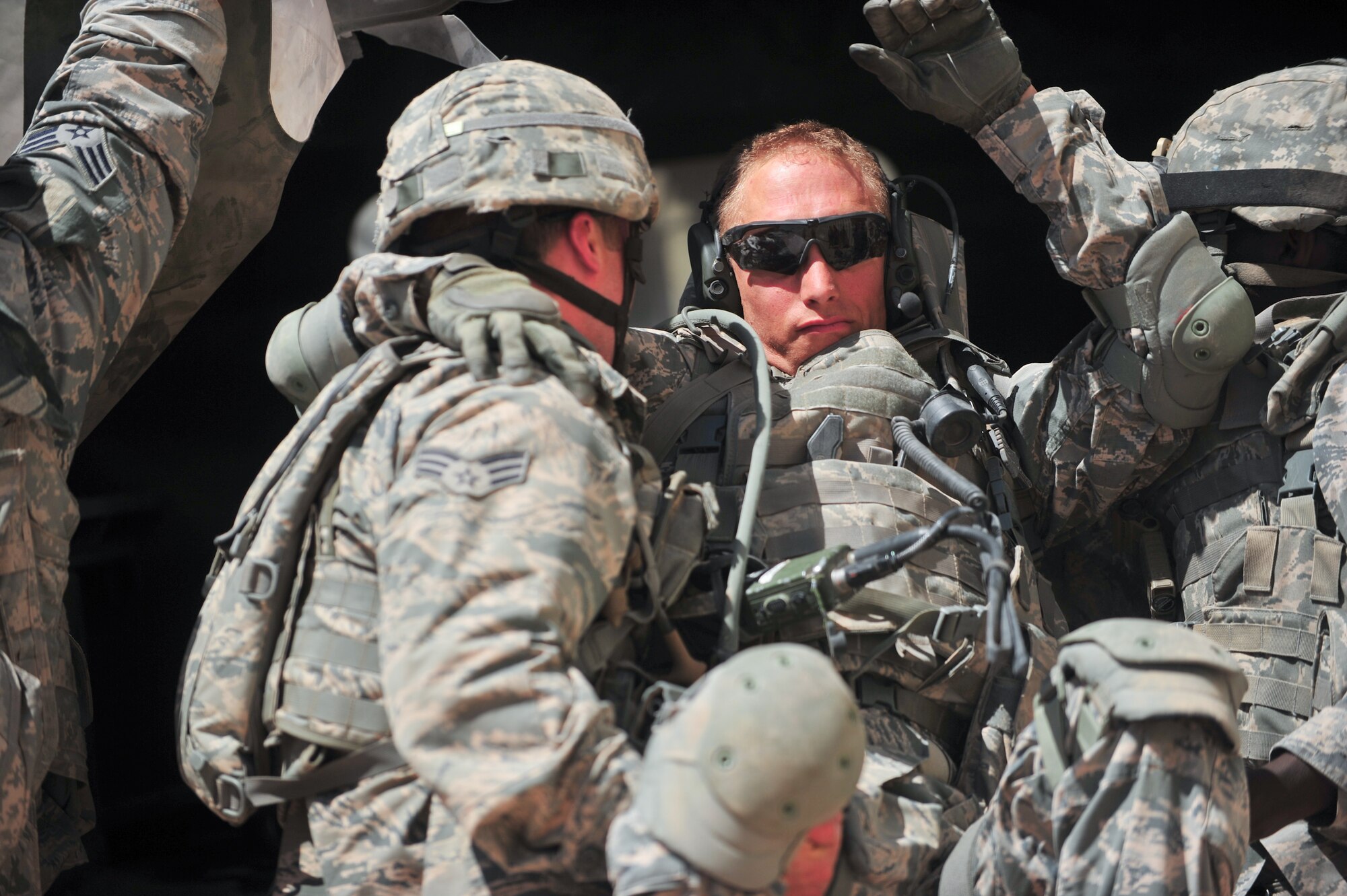 Air Force Reserve Airman 1st Class Jonathan Kliewer receives attention for a simulated injury during an ambush Aug. 11, 2015, at Camp Guernsey, Wyo. The 310th, 710th and 919th Security Forces Squadrons held a two-week field training exercise while living in field conditions.
(U.S. Air Force photos/Tech. Sgt. Nicholas B. Ontiveros)