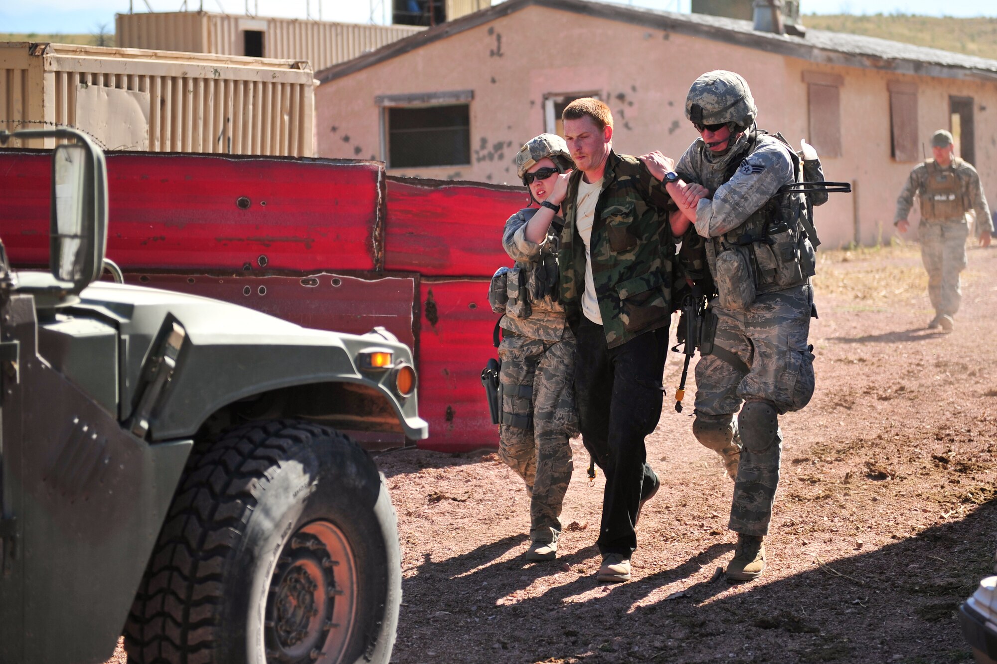 Air Force Reservist detains a simulated terrorist Aug. 12, 2015, at Camp Guernsey, Wyo. The 310th, 710th and 919th Security Forces Squadrons held a two-week field training exercise while living in field conditions.
(U.S. Air Force photos/Tech. Sgt. Nicholas B. Ontiveros)