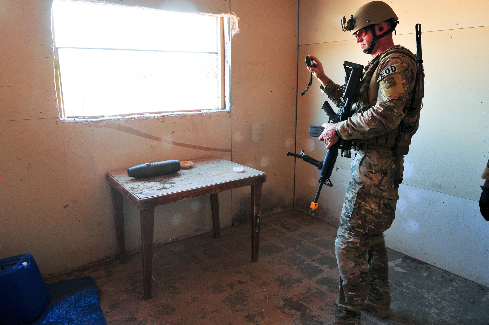 An Air Force Reserve explosive ordnance disposal specialist identifies and records a simulated homemade bomb Aug. 12, 2015, at Camp Guernsey, Wyo. The 310th, 710th and 919th Security Forces Squadrons held a two-week field training exercise while living in field conditions.
(U.S. Air Force photos/Tech. Sgt. Nicholas B. Ontiveros)