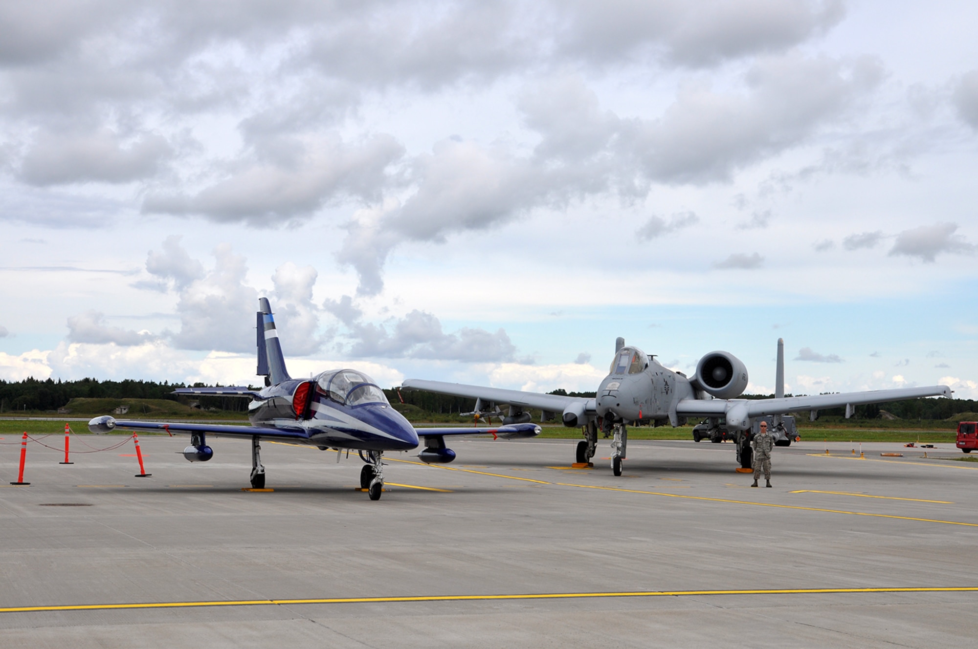 The Aero L-39C Albatros, used as a training aircraft by the Estonian Air Force is parked next to an A-10 Thunderbolt II from Whiteman Air Force Base Mo., during a media day event at Amari Air Base Sept. 4. This formation symbolizes the U.S. military partnering with European allies to show dedication to peace in the region as part of Operation Atlantic Resolve. (U.S. Air Force photo by Capt. Denise Haeussler)